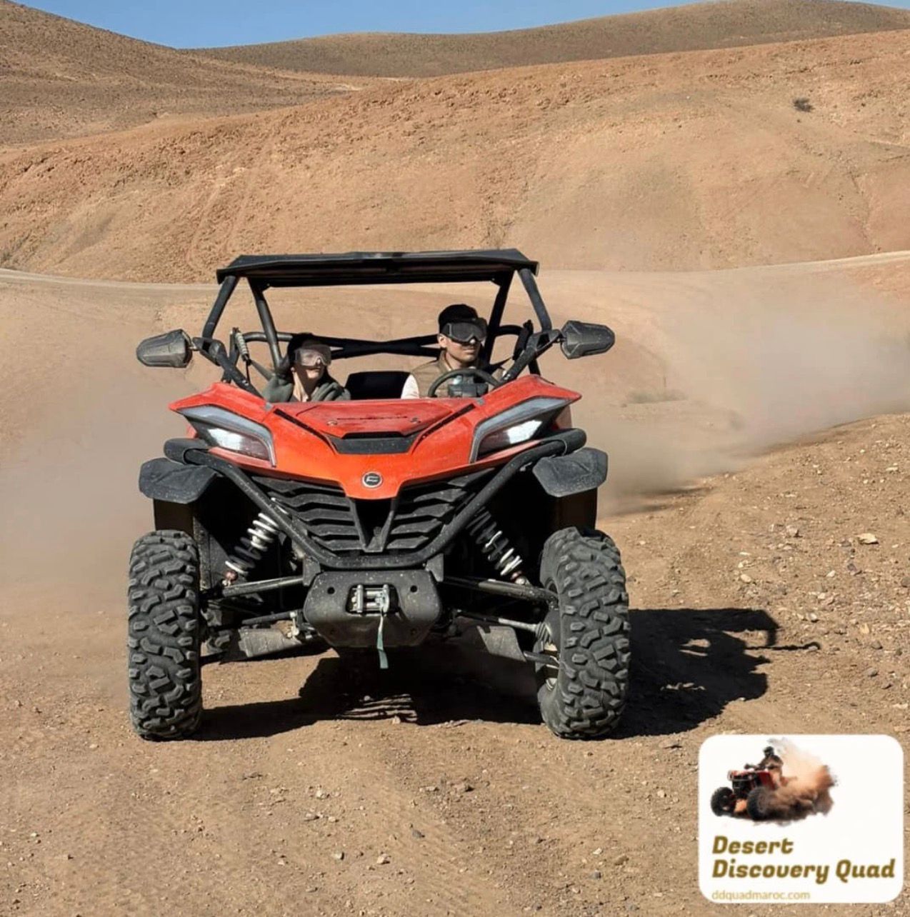 A two-seat buggy crossing the Agafay hills.
